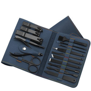 Manicure set with black tools in a blue case on a white background