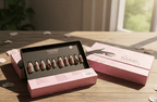 Makeup palette with lipsticks on a wooden surface, featuring the brand 'Fable'.