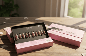 Makeup palette with lipsticks on a wooden surface, featuring the brand 'Fable'.