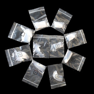 Silver foil packages with numbers on a black background
