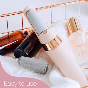 Cosmetic bottles with applicators on a textured surface