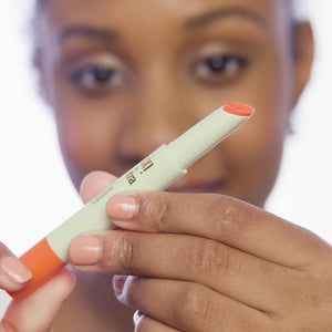 Person holding a marker with a blurred background