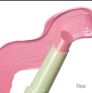 Pink lip balm with visible brand name on a white background