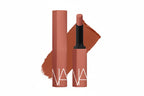 Red cylindrical tool with a black handle on a white background