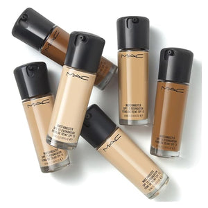 MAC foundation bottles in various shades on a white background
