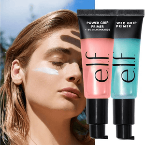 Two e.l.f. Power Grip Primer tubes with a blurred outdoor background