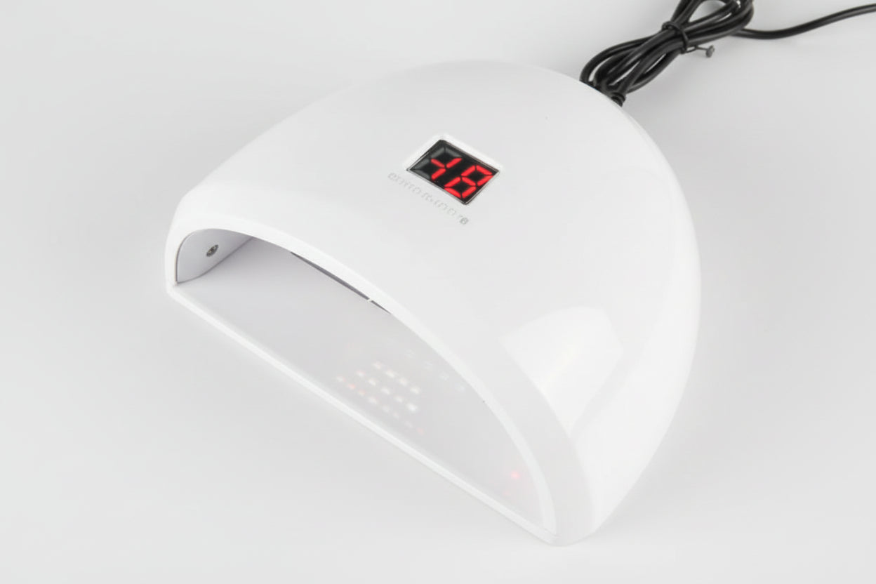 White electronic device with digital display on a light gray background
