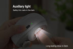 Nail clipper with auxiliary light being used in a dark setting