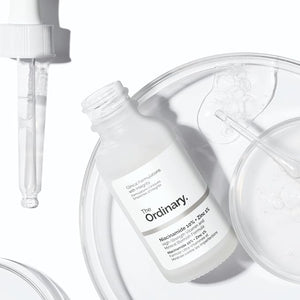 Skincare bottle labeled 'The Ordinary' with a dropper on a white background