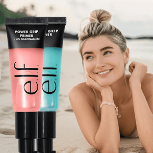 Two e.l.f. Power Grip Primer tubes with a woman lying on sand in the background