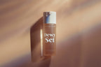 Anastasia Beverly Hills Dewy Set setting spray on a brown background