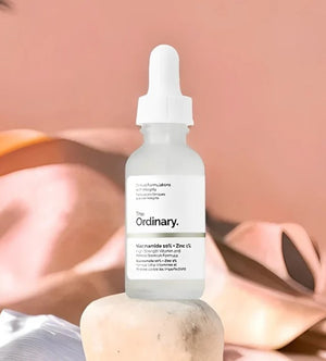 The Ordinary skincare serum bottle on a blurred background
