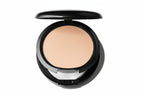 Compact powder in a black case on a white background