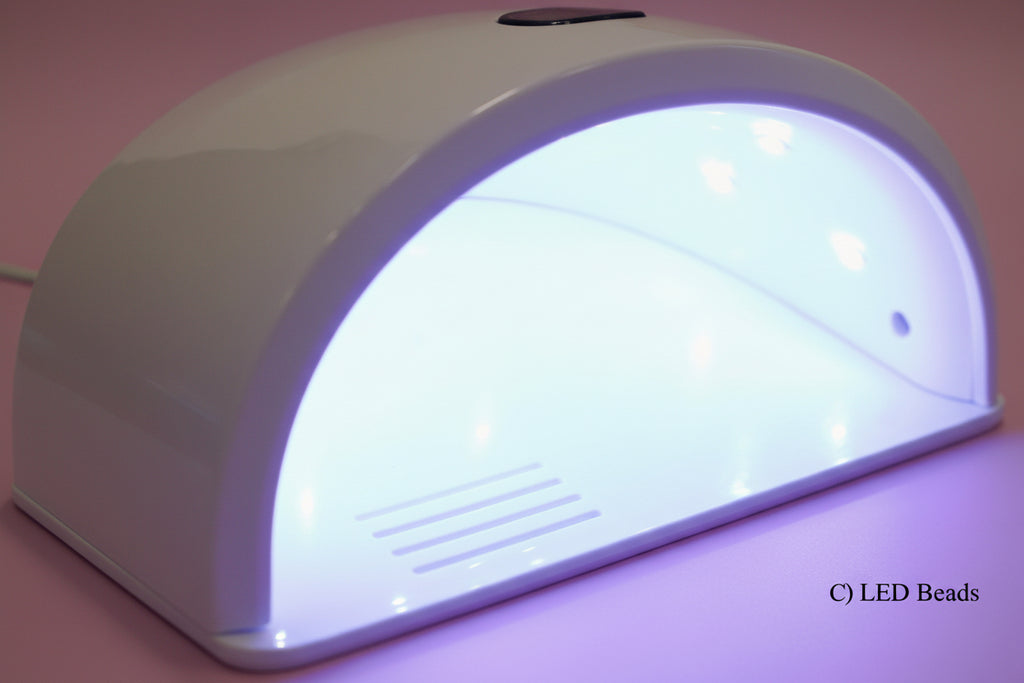 Close-up of a LED light strip with 12 LED beads on a purple background