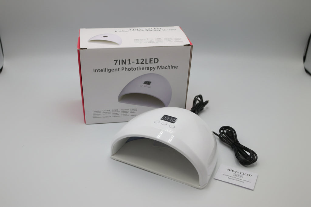 White phototherapy machine with packaging and cable on a white background