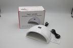 White phototherapy machine with packaging and cable on a white background