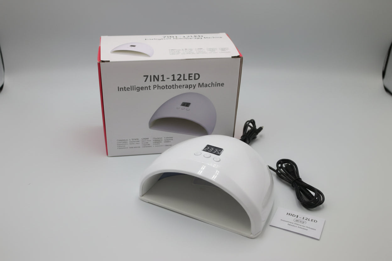 White phototherapy machine with packaging and cable on a white background