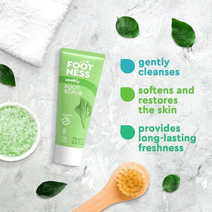 Foot scrub tube with green leaves and text on a textured surface