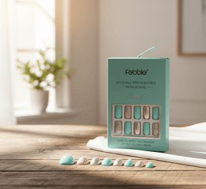 Box of Febble false nails on a wooden surface with a blurred background