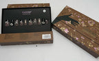 Set of nail polish with a branded box on a white surface