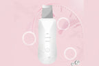 White electronic device with gray top on a pink background