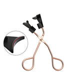 Eyelash curler with black clips on a white background