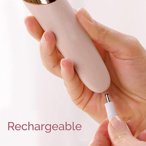 Hand holding a pink rechargeable nail drill with a clear background