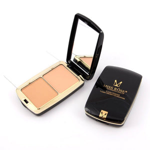 Compact powder with open lid showing two shades and black case on a white background