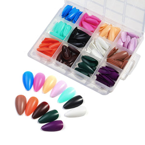 Set of colorful nail tips in a transparent box on a white background