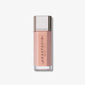 Cosmetic bottle with 'Anastasia' branding on a light pink background